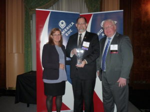 Tim Robinson (center), Director of Operations for Lenawee Now, accepts a first place marketing award from Barb LaMue, 2016 Mid-America EDC President, and Ron Starner, General Manager, Conway Data Inc.