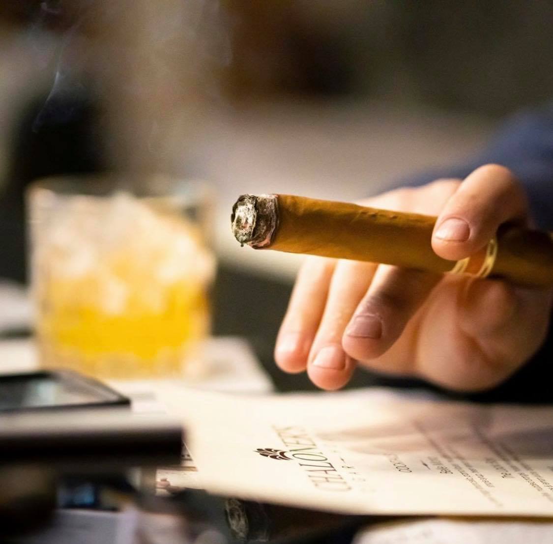Man with Cigar at Bar