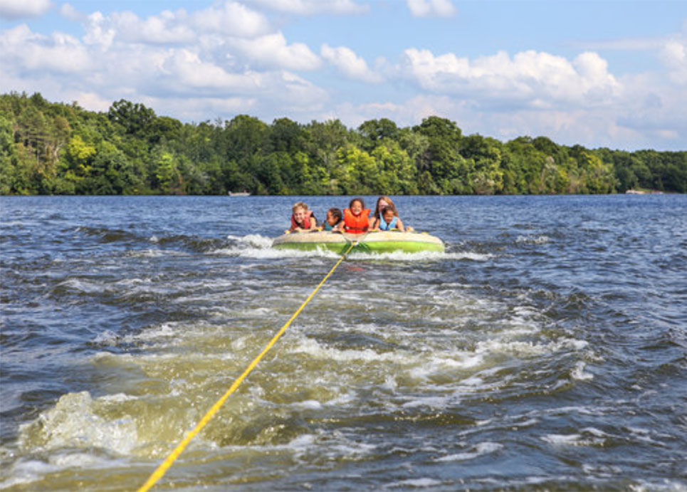 Kids Tubing on a Lake