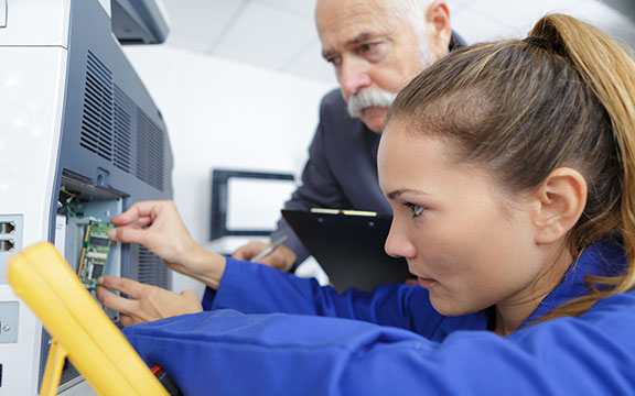 young female electrician at work